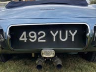 3.8L E-types merely have Jaguar (no engine size) as a boot badge