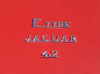 4.2 litre E-types had the engine capacity on the boot badge